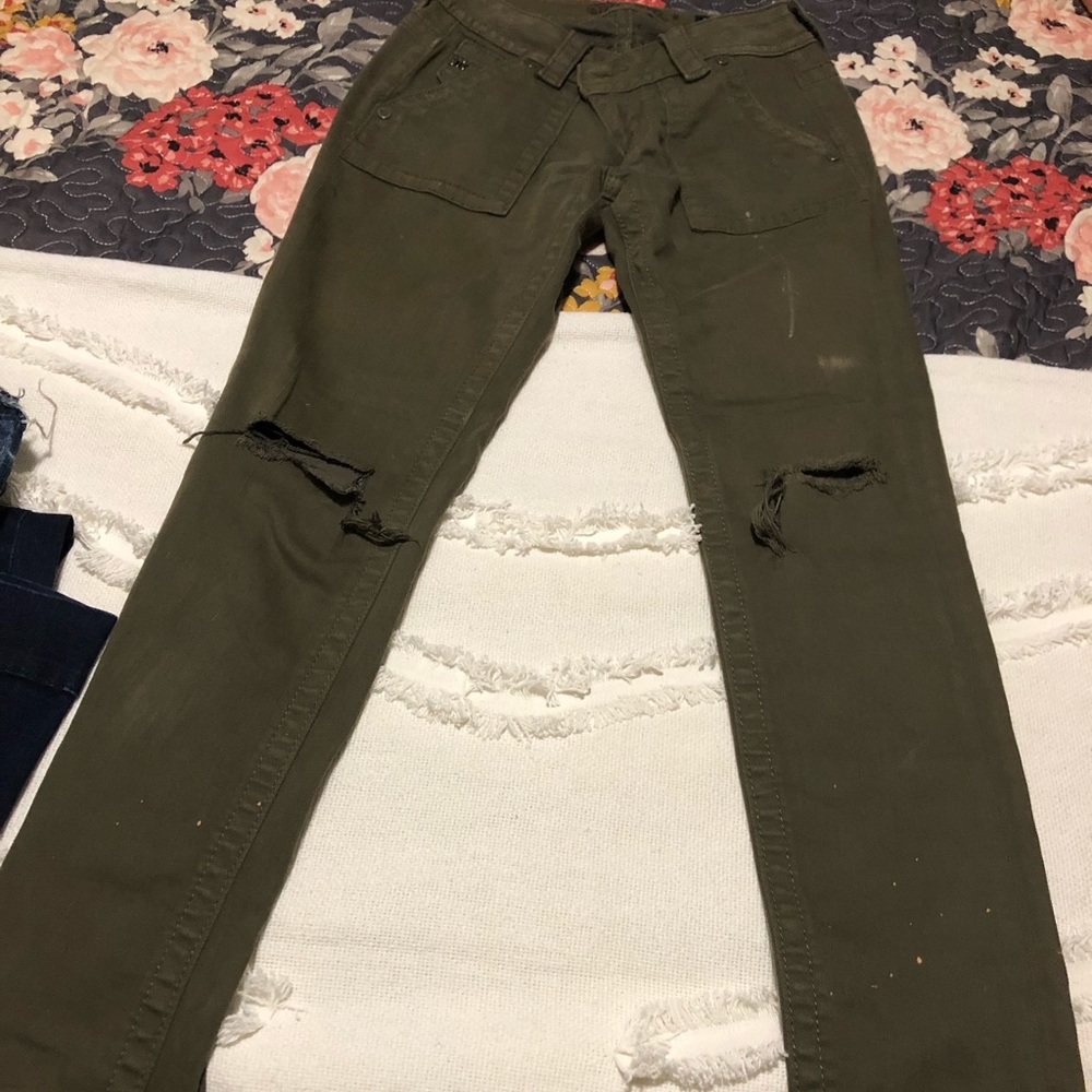 Army green distressed skinnies